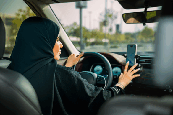 Saudi woman driver using Uber app in car as part of Uber Women Drivers launch.