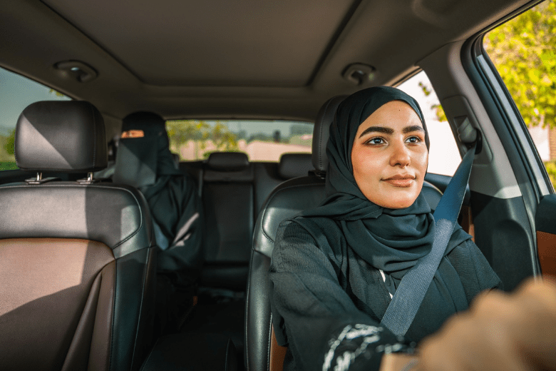 Saudi woman driver with female passenger during Uber Women Drivers ride.