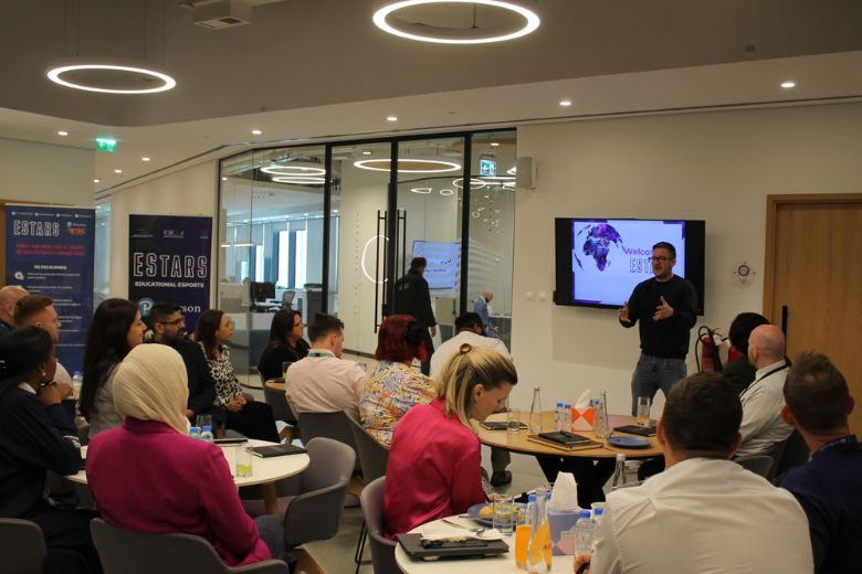Educators attending a professional development talk introducing the EStars esports CPD course.