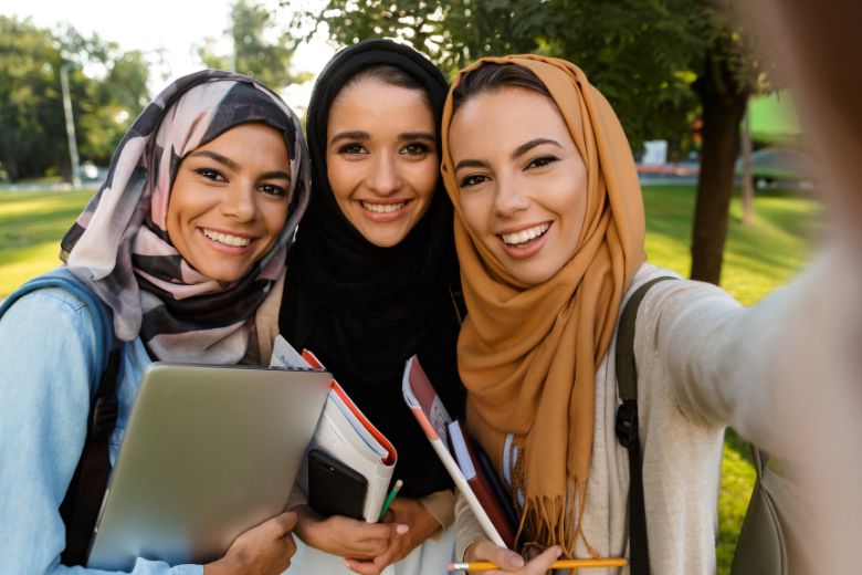 Students studying at a Saudi university campus