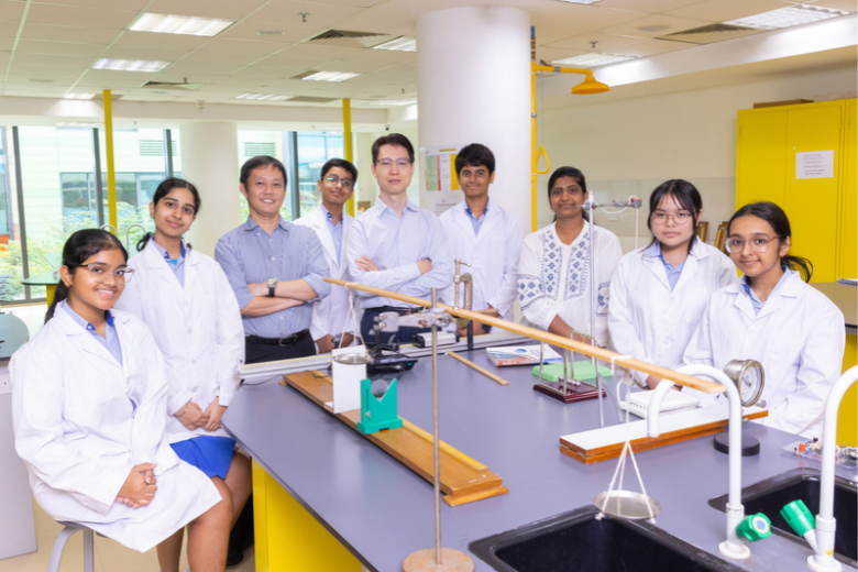 Students conduct a hands-on science experiment, applying classroom knowledge through practical learning